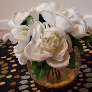 Glass round vase with white fake flowers